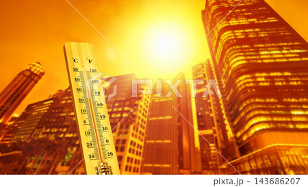 Wooden thermometer showing high temperatures against a warm, sunny cityscape background, representing heatwave and global warming concept. 143686207