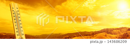 Thermometer showing high temperature against a scorching sun and blazing sky, illustrating extreme summer heatwave and global warming concept. Thermometer showing high temperature against a scorching sun and blazing sky, illustrating extreme summer heatwave and global warming concept. 143686209