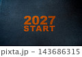 Orange numbers 2027 and the word start on a dark textured background symbolizing the beginning of the year 2027. Concept of Happy New Year 143686315