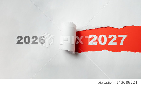 White paper torn revealing the year 2027 instead of 2026 on a red background. Concept of changing years, transition, future, and time passing. Concept of Happy New Year White paper torn revealing the year 2027 instead of 2026 on a red background. Concept of changing years, transition, future, and time passing. Concept of Happy New Year 143686321