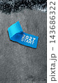 Blue torn paper with the text 2027 start on a gray stone texture background with tinsel at the top. Concept of Happy New Year 143686322
