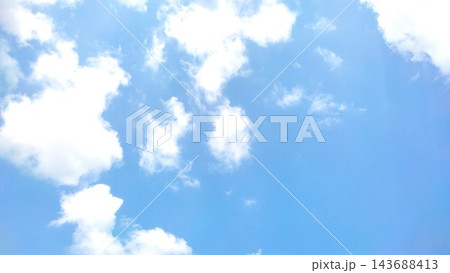 Bright Summer Sky with Scattered White Fluffy Clouds Background Bright Summer Sky with Scattered White Fluffy Clouds Background 143688413