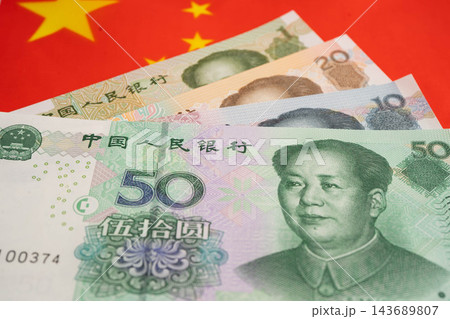 China yuan banknote money with flag, investment economy business and banking. China yuan banknote money with flag, investment economy business and banking. 143689807