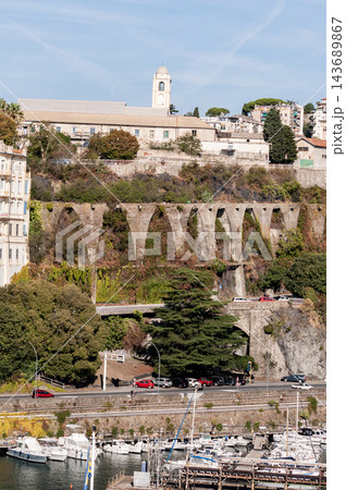 Savona, Italy with port and hillside buildings, panoramic coastal view Savona, Italy with port and hillside buildings, panoramic coastal view 143689867