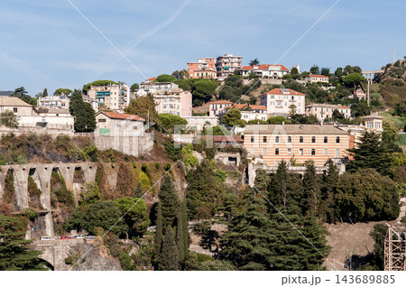 Savona, Italy with port and hillside buildings, panoramic coastal view Savona, Italy with port and hillside buildings, panoramic coastal view 143689885