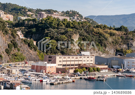 Savona, Italy with port and hillside buildings, panoramic coastal view Savona, Italy with port and hillside buildings, panoramic coastal view 143689886