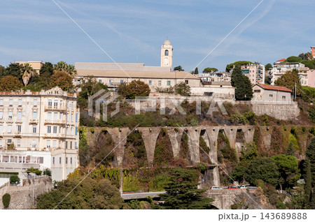 Savona, Italy with port and hillside buildings, panoramic coastal view 143689888