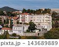 Savona, Italy with port and hillside buildings, panoramic coastal view 143689889