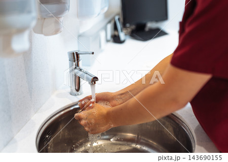 doctor assistant, doctor washes hands doctor assistant, doctor washes hands 143690155