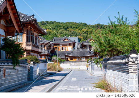 Traditional Korean Hanok Houses and Tiled Roofs against Bukhansan Mountain in Eunpyeong Hanok Village, Seoul Traditional Korean Hanok Houses and Tiled Roofs against Bukhansan Mountain in Eunpyeong Hanok Village, Seoul 143696026