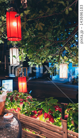 colorful lanterns glowing in thailand night street, tropical evening garden with illuminated lamps 143696183