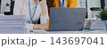 Two Asian businesswomen are facing stress and headache at the office, feeling exhausted from work pressure, focusing on mental health and stress management in a stressful corporate environment. 143697041