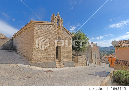Traditional stone chapel and village street in Aggius Sardinia Traditional stone chapel and village street in Aggius Sardinia 143698346