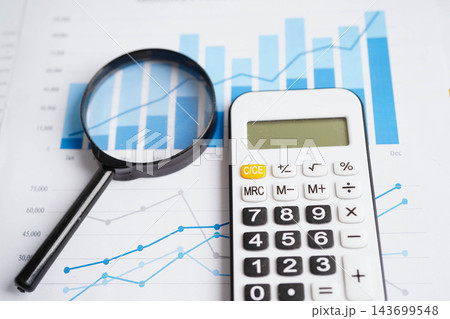 Calculator on chart graph paper. Finance, account, statistic, investment data economy, stock exchange business. Calculator on chart graph paper. Finance, account, statistic, investment data economy, stock exchange business. 143699548