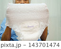 Asian senior woman patient wearing adult incontinence diaper pad in hospital. 143701474