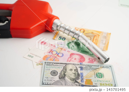 Gas pump, Fuel Nozzle with banknote money for cost energy. 143701495