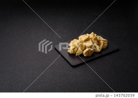 White cocoa butter chunks, used as an ingredient for making chocolate and sweets 143702039