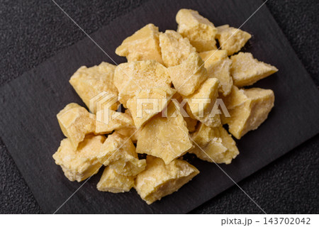 White cocoa butter chunks, used as an ingredient for making chocolate and sweets 143702042