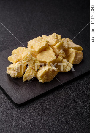 White cocoa butter chunks, used as an ingredient for making chocolate and sweets 143702043