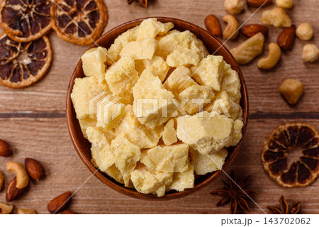 White cocoa butter chunks, used as an ingredient for making chocolate and sweets 143702062