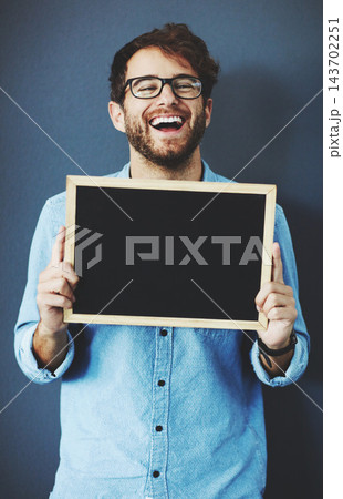Happy, man and teacher with chalkboard for mockup space with marketing, promotion or advertising. Laugh, glasses and male educator from Canada with sign for education isolated by studio background. 143702251