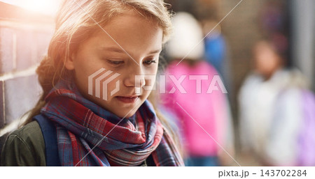 Bullying, lonely and outcast with child student in hallway of school for depression or mental health. Anxiety, education and thinking with sad learner alone at school as victim of intimidation 143702284