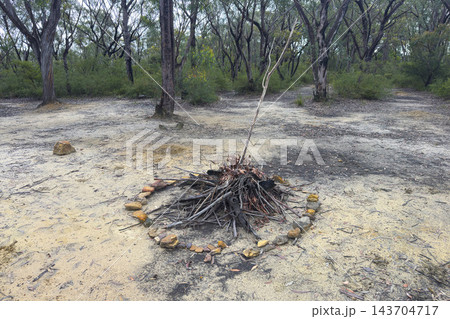 A small and basic camping fire pit on a dirt track in the Blue Mountains 143704717