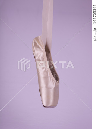 Ballet Pointe Shoe Close-Up on Lavender Studio Background 143705343