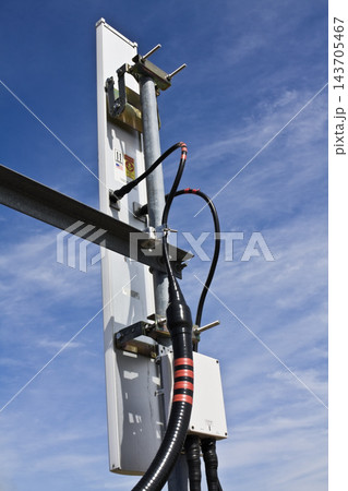 Cellular Antenna Equipment on Telecom Mast Against Blue Sky Cellular Antenna Equipment on Telecom Mast Against Blue Sky 143705467
