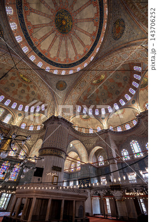 Istanbul,turkey,august 6, 2025. Sultan ahmed - blue - mosque interior with soaring central dome, ornate iznik tiles, arches, stained glass and arabic calligraphy Istanbul,turkey,august 6, 2025. Sultan ahmed - blue - mosque interior with soaring central dome, ornate iznik tiles, arches, stained glass and arabic calligraphy 143706252