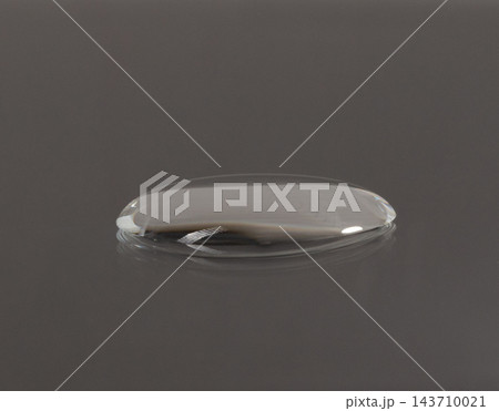 Pure water droplets on a dark surface tension. Water drops rolling off waterproof coating surface tension physics detail clean background, Macro Photography 143710021