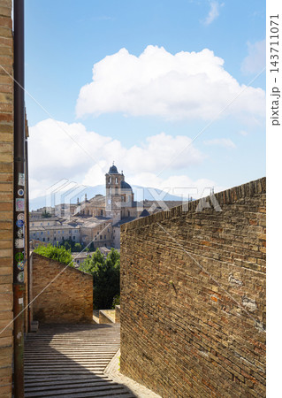 a staircase between the houses in the historic center of Urbino, Italy 143711071