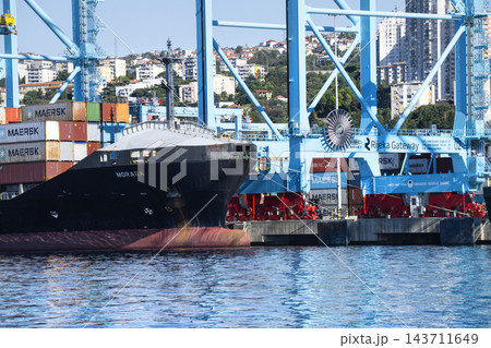 A large container ship docked at the port of Rijeka, Croatia A large container ship docked at the port of Rijeka, Croatia 143711649