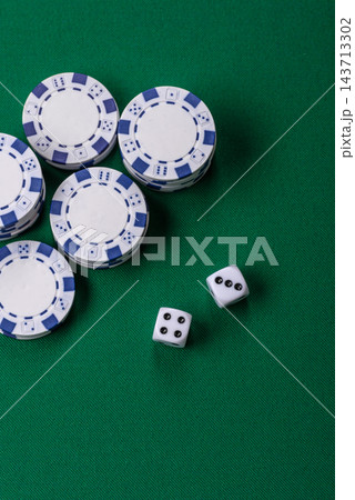 Multicolored casino chips as a conceptual backdrop for gambling games like poker, blackjack Multicolored casino chips as a conceptual backdrop for gambling games like poker, blackjack 143713302