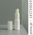 Open lip balm stick mockup with a lid in sage green bathroom. Herbal cosmetic product for daily use 143720029