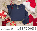 Blank dark blue folded sweatshirt mockup near Christmas decor, copy space. Holiday apparel flat lay 143720038