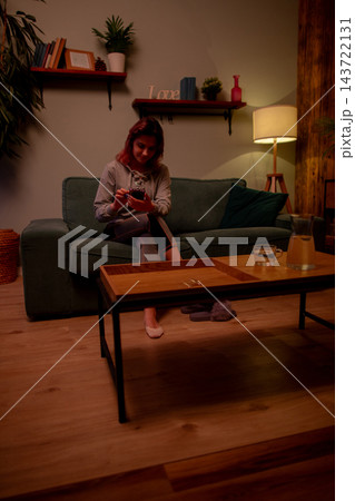 Woman resting peacefully. Lady takes calm and relaxing break peacefully. Female individual finds serene comfort while relaxing in cozy and welcoming atmosphere among friends 143722131