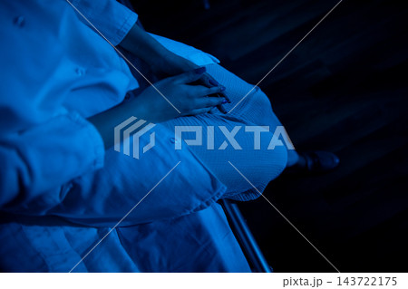 Gentle grip on pillow amid soothing blue lighting and textures. Peaceful moments captured with hands gripping pillow under calm blue illumination and tactile details Gentle grip on pillow amid soothing blue lighting and textures. Peaceful moments captured with hands gripping pillow under calm blue illumination and tactile details 143722175