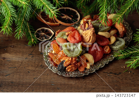 Assorted dried fruits and nuts on a silver tray. Assorted dried fruits and nuts on a silver tray. 143723147