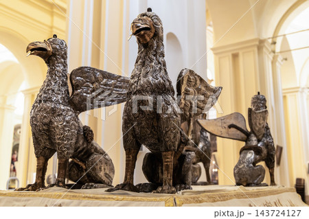 Silver eagle sculptures used in religious procession displayed inside a church in the baroque city of Noto, Sicily. 143724127