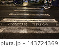 Pedestrian crossing on a tram line in a city at night 143724369
