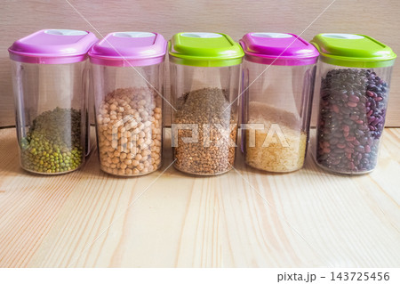 Kitchen Pantry Organization: Transparent Jars Filled with Grains and Legumes 143725456