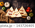 Spooky Halloween taco in shape of jack-o-lantern 143726405