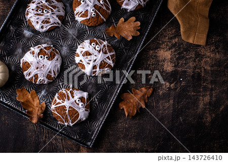 Spooky Halloween mummy cookies with eyes 143726410