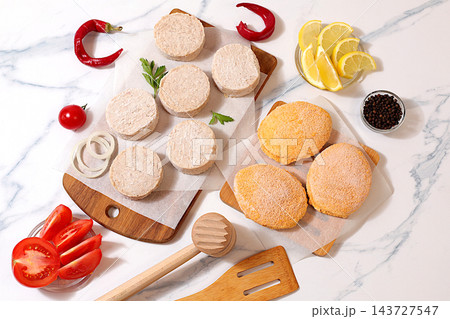 Frozen raw patties for quick preparation patties made from a variety of minced meats, seasoned with onion, tomato, lemon, garlic, and pepper , recipe for appetizing schnitzels and beefsteaks, 143727547