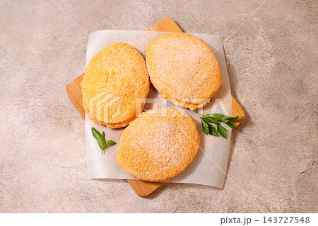 Frozen raw patties for quick preparation . Soy meat patties,vegetarian and vegan food, onion, tomato, lemon, garlic,recipe for appetizing schnitzels and beef steaks, menu options for a cafe 143727548