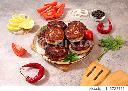 Homemade patties made from ground beef and pork featuring onion, tomato, lemon, garlic, recipe for delicious schnitzels and beef steaks, menu options for cafe banner for fastfood establishment 143727563