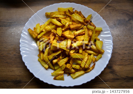Fried potatoes with smoked paprika in pan Fried potatoes with smoked paprika in pan 143727956
