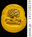 Close-Up Half Pumpkin With Seeds And Vibrant Orange Flesh On Black Background, Autumn Harvest Produce 143728239