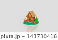 Charming Miniature Christmas House with Decorated Tree and Gifts on White Background 3d render. 143730416